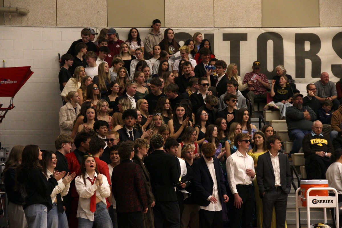 SVHS students fill the visiting student section at Jackson Hole High School in their Hollywood attire. Every year Brave basketball fans drive to Jackson to support their teams. Senior Kimball Hulse said, "I like hanging out with my friends at the games and bringing energy to the players."