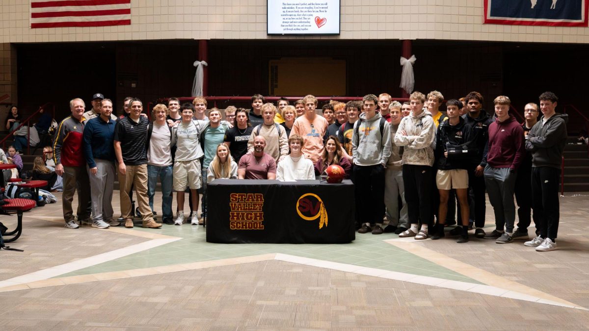 Quarterback Phoenix Hovey joins family, friends and teammates for his signing with Rocky Mountain College to play football.