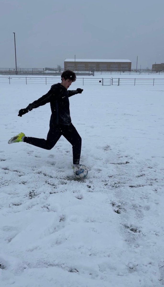 Jonah Finch runs up to shoot a goal during open field. This is Jonah's third year doing soccer. "I like having all of the open fields; it helps us prepare for the season," said Finch.