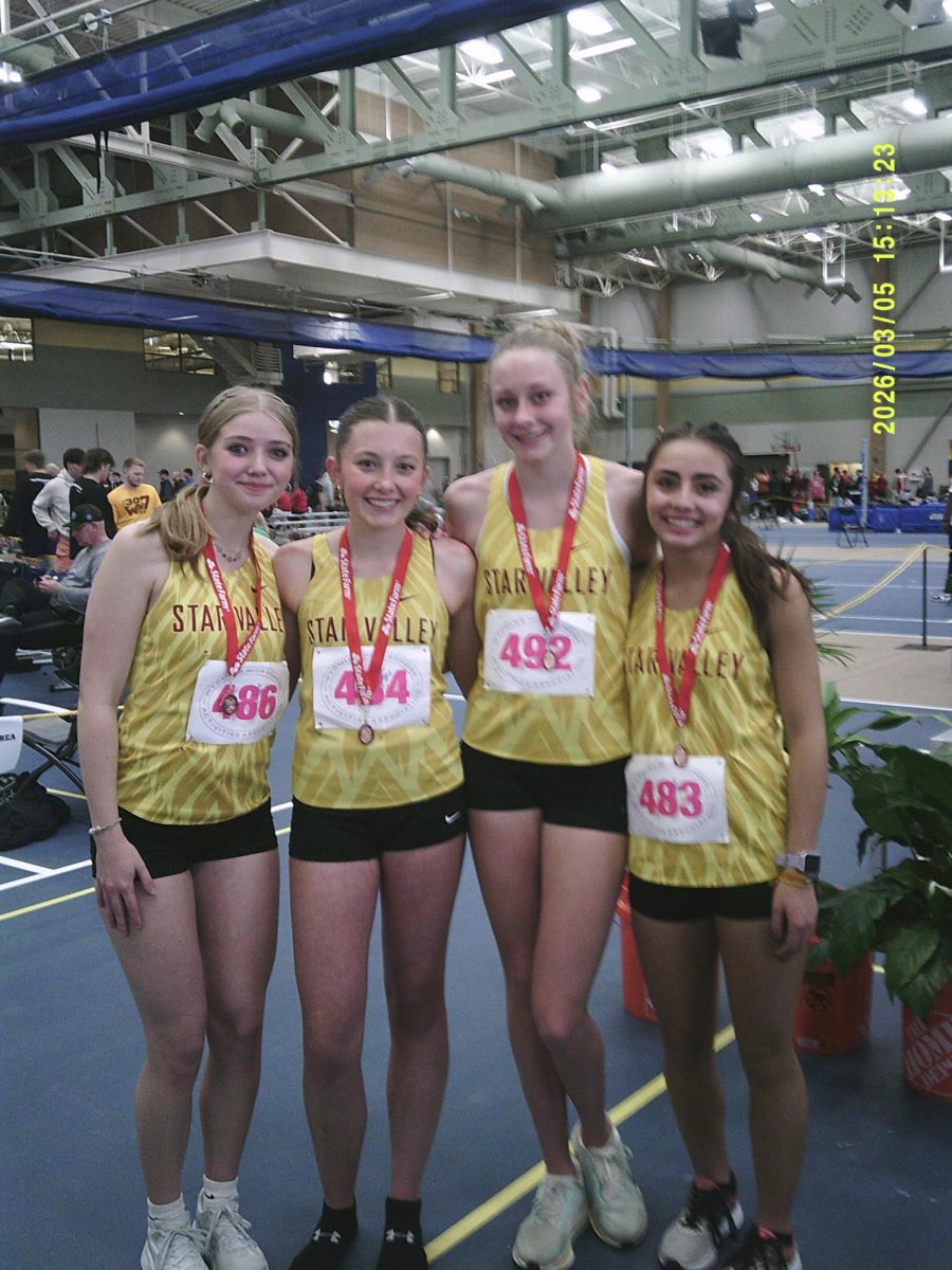 Star Valley's Girls medley team (Morgan King, Mylie Kaiser, Gracie Visser, and Zoey Jones) come together after placing 6th in the Wyoming state track. 