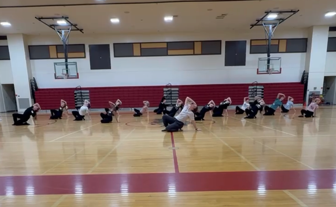 Coach Darbi Stoll teaches a jazz routine on the 2nd day of tryouts. The routine was around 1 minute long and consisted of many skills that are necessary to know for the final tryout day. Stoll was excited to see how skilled and determined the girls were. She said, "There was so much determination and ambition in the room, and it made me even more excited for the upcoming season. It’s always inspiring to see young dancers show up willing to challenge themselves and give their best effort."  
