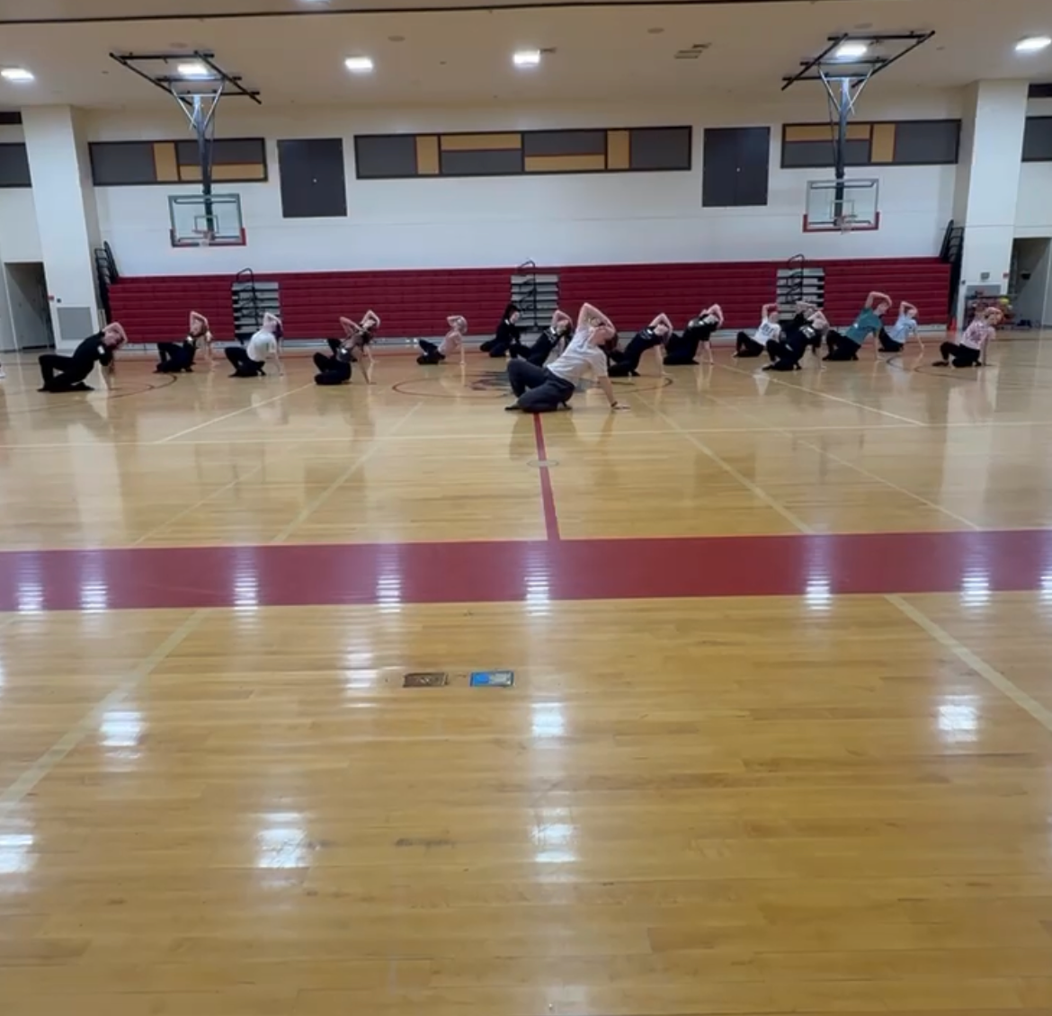 Coach Darbi Stoll teaches a jazz routine on the 2nd day of tryouts. The routine was around 1 minute long and consisted of many skills that are necessary to know for the final tryout day. Stoll was excited to see how skilled and determined the girls were. She said, "There was so much determination and ambition in the room, and it made me even more excited for the upcoming season. It’s always inspiring to see young dancers show up willing to challenge themselves and give their best effort."  