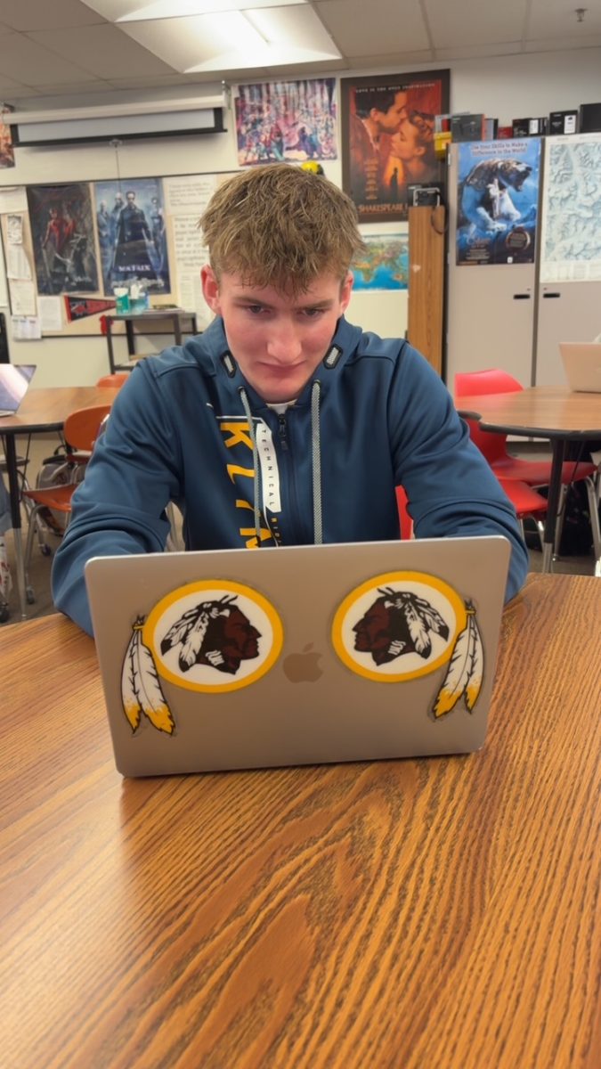 Student Dylan Hirschi works hard in English class. He has always had to balance school, sports, and work during high school.