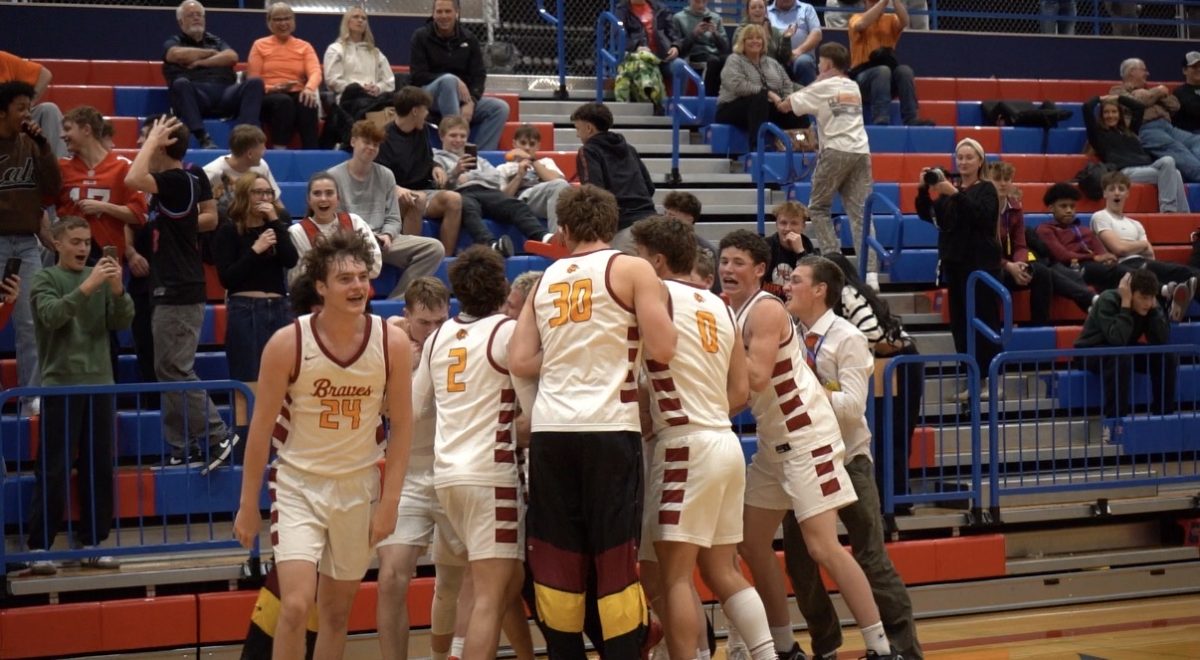 The Braves start a victory celebration on Evanston high school's basketball court.