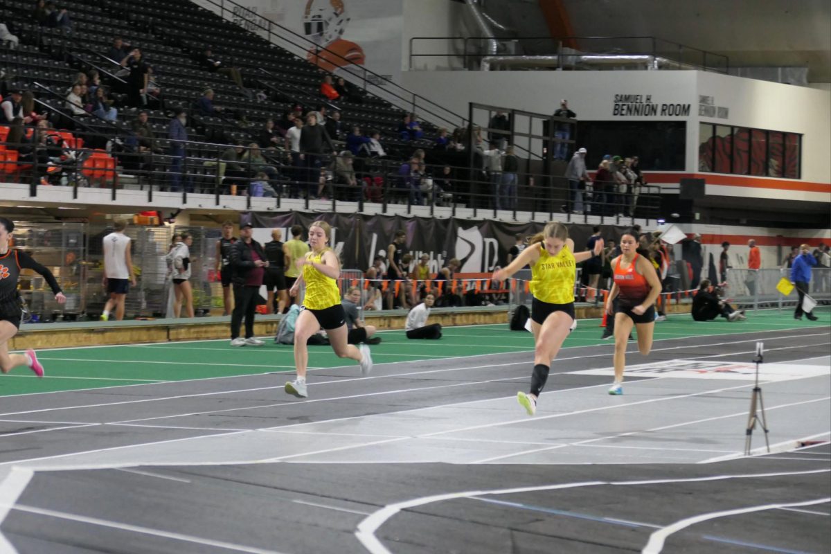Junior Kaelyn Green, drives through the finish line in the 200 meter during the State Indoor Track Meet at the Campbell County Recreation Center Field House. With her eyes locked ahead and arms powering forward, Green leans at the line in a tight race that came down to fractions of a second, a moment many in the crowd may not have realized was one of her fastest starts of the season. “I just focused on exploding out of the blocks and staying strong through the finish,” Green said. “In a race this close, every step matters.”