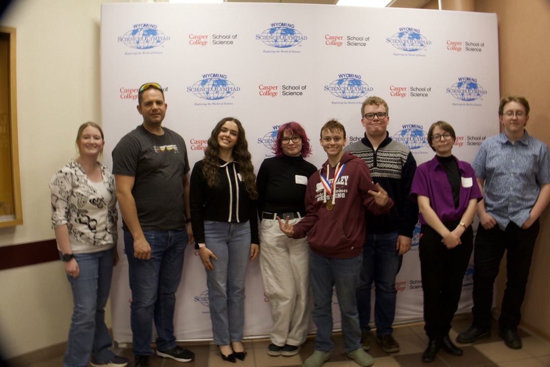 As Tootsie Peterson, Marie Batemen, Mr Hepworth, Emma Moreton, Thomas Randall, Ian Coles, Mrs Finch, and Isabella Burton take a picture as a group, Marie says," I'm happy we could connect over nerd events and get to know eachother better."