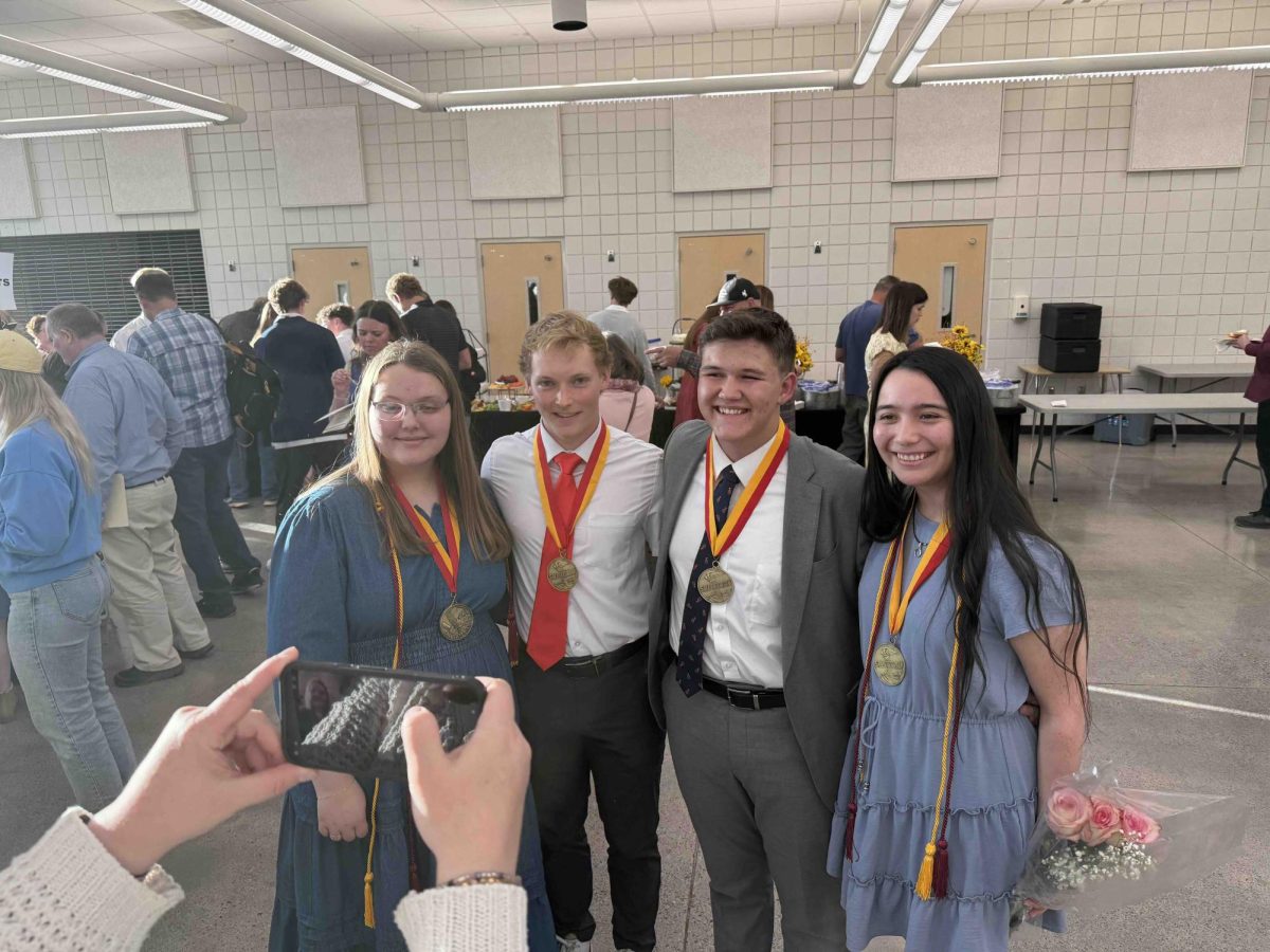 Co-Valedictorians Lydie Clove, Zach Tyler and Anahi Bosch-Barnes stand with Salutatorian Cooper Daniel (2nd from right). These standout scholars addressed an audience of their peers and friends and family at a graduation commencement ceremony on Thursday, 5-28
