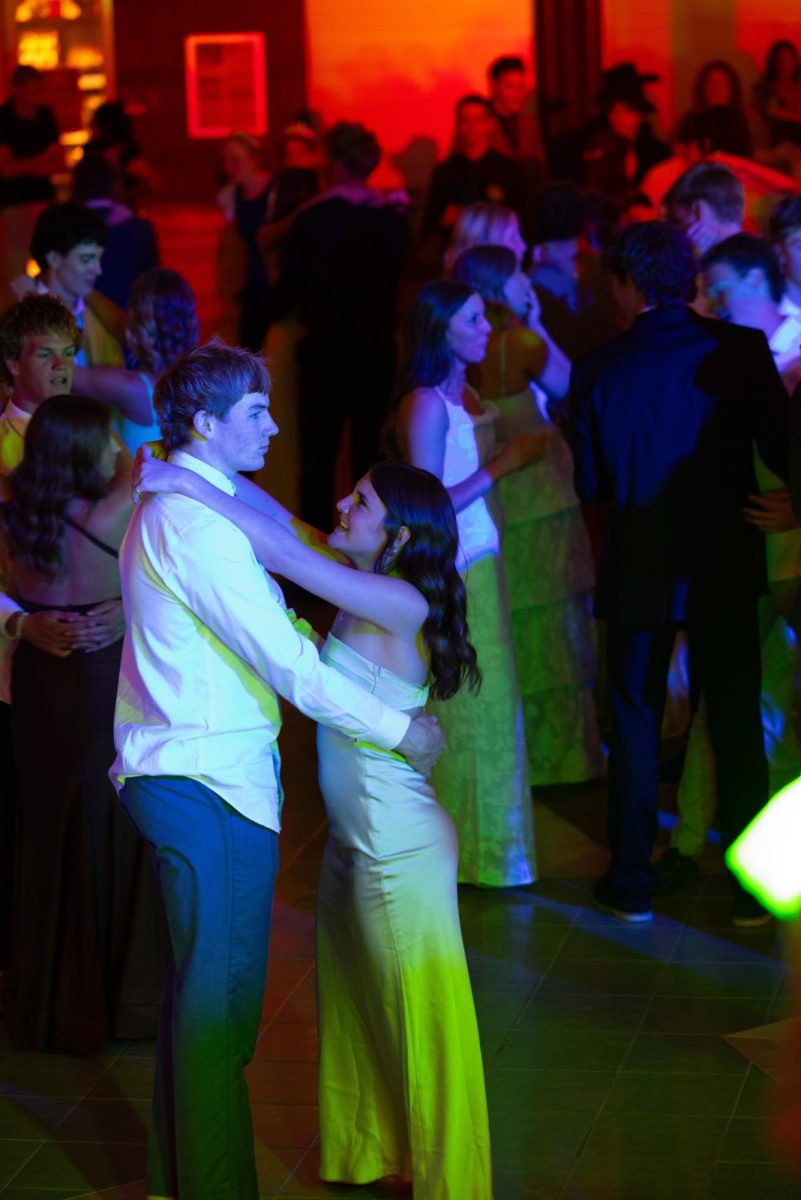 Juniors Roman Erickson and Paylan Merritt dance together as students fill the dance floor throughout the night. The two spent the evening enjoying music, dancing, and time with friends and classmates. Erickson remembers his favorite part of prom. "My favorite part of prom was definitely when Beauty and a Beat by Justin Bieber was playing and everyone was going crazy in the mosh and singing."